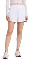 BEYOND YOGA IN STRIDE LINED SHORTS TRUE WHITE