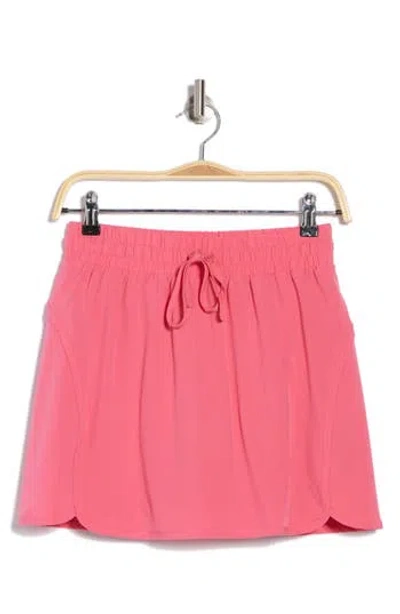 Beyond Yoga In Stride Lined Skort In Pink Horizon