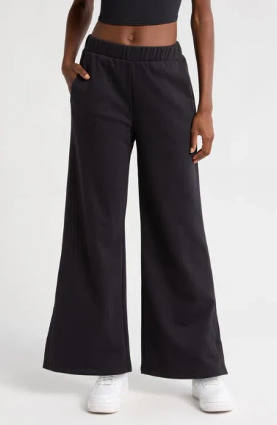 Beyond Yoga Open Ended Mid Rise Wide Leg Pants In Black