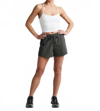Beyond Yoga Peak Mid Rise Shorts In Slate Green In Gray