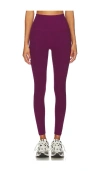 Beyond Yoga Caught In The Midi Legging In Aubergine-beet In Purple