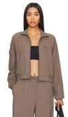Beyond Yoga Status Pocket Sleeve Cropped Jacket In Dune