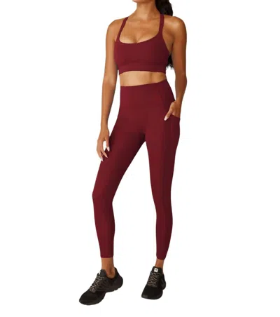 Beyond Yoga Strive Pocket Midi Legging In California Merlot In Multi