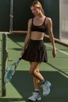 Beyond Yoga Team Pleated Mini Skirt In Black