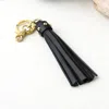 Bijourocks Nat Brass Tassel Key Chain In Black Licorice