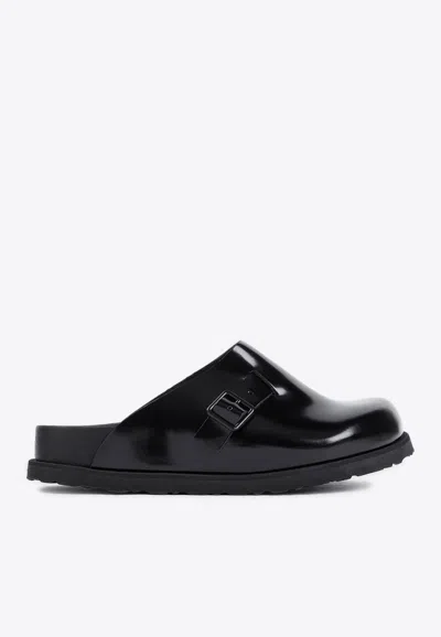 Birkenstock Niamey Buckled Glossed-leather Clogs In Black
