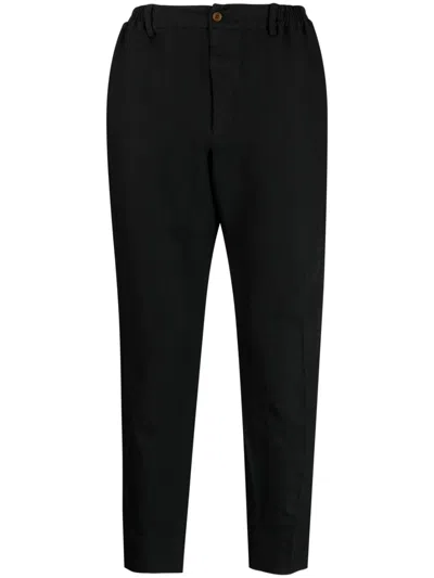 BLACK COMME DES GARÇONS CHEVRON-PATTERN TAPERED TROUSERS