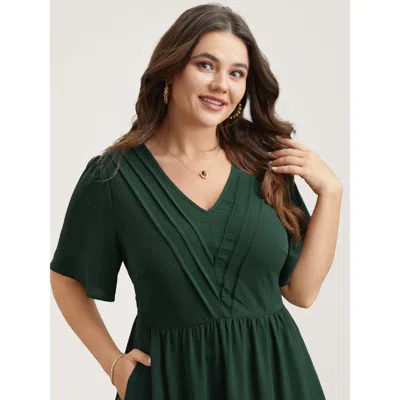 Bloomchic Women's Plus Size Bib-front V-neck Pockets Tiered Mini Dress Darkgreen Solid Midi Elegant Non 10/m In Green