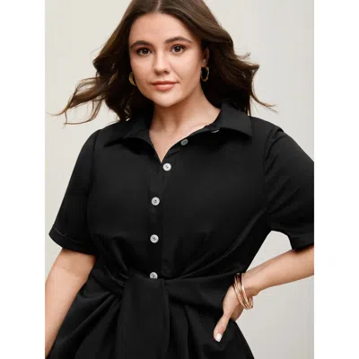 Bloomchic Women's Plus Size Knotted Front Asymmetrical Hem Blouse Black Solid Office Short Sleeve Collared Nec