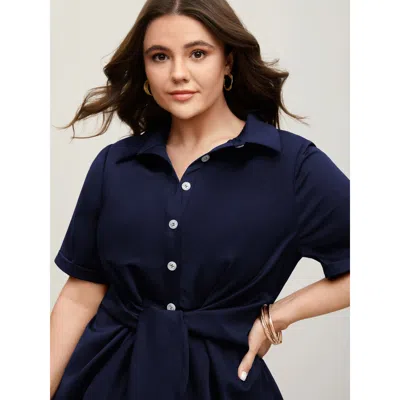 Bloomchic Women's Plus Size Knotted Front Asymmetrical Hem Blouse Indigo Solid Office Short Sleeve Collared Ne In Purple