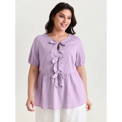 Bloomchic Women's Plus Size Texture Bow-front Detail Plain Blouse Lilac Solid Casual Short Sleeve V-notch Neck In Purple
