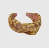 Bohemian Gemme Women's Fall Floral Embroidered Knotted Headband In Brown/yellow In Multi