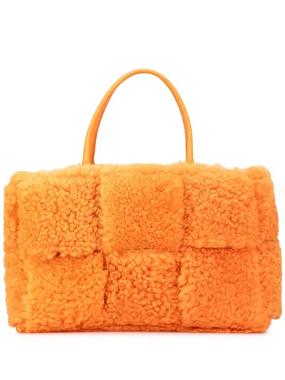 Pre-owned Bottega Veneta 2012-2025 Small Shearling Intrecciato Arco Tote Bag In Orange