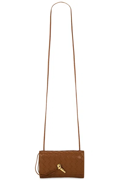 Bottega Veneta Andiamo Slim Pouch On Strap In Tannin & Muse Brass