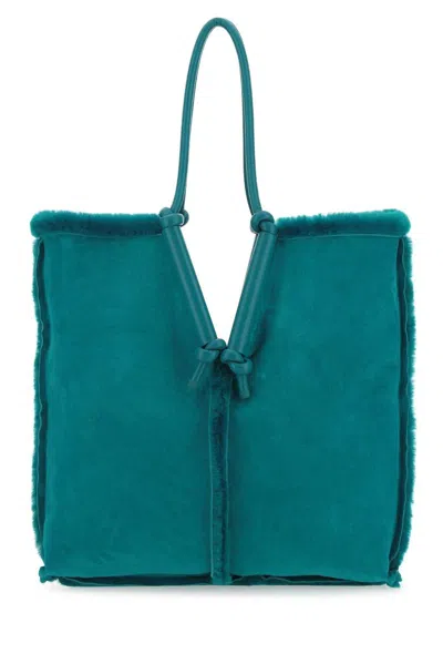 Bottega Veneta Teal Green Shearling Bolster Shoulder Bag In Blue