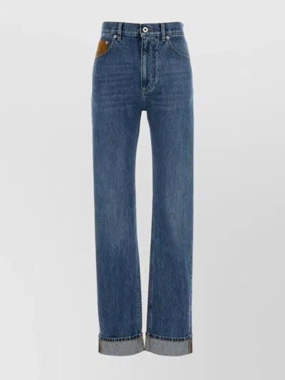 BOTTEGA VENETA FIVE-POCKET DENIM TROUSERS FEATURING ROLLED CUFFS