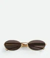 Bottega Veneta Ovale Sardine Sonnenbrille In Gold/gold/grey