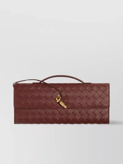 BOTTEGA VENETA TRAVEL CLUTCH WITH WOVEN LEATHER HANDLE