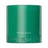 Boy Smells Herbaceous Candle In Green