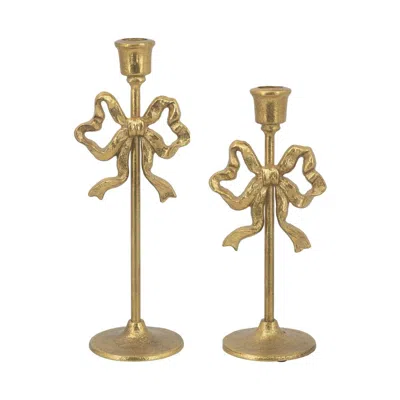 Breebe Set Of 2 Gold Cast Iron Candle Holders With Playful Bow Design