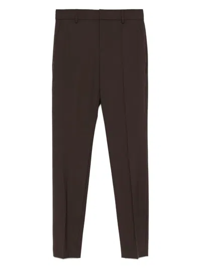 Brunello Cucinelli Tapered Wool Trousers In Black