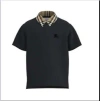 BURBERRY BLACK POLO SHIRT FOR BOY WITH VINTAGE CHECK ON THE COLLAR
