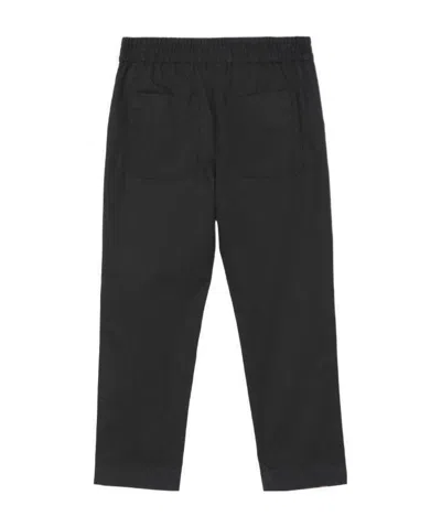 Burberry Embroidered Monogram Trousers In Black