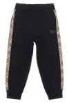 Burberry Black Jogging Trousers With Check Motif Detail In Black