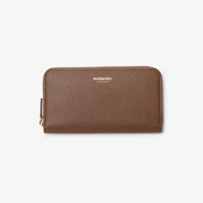 Burberry Large Leather Zip Wallet In Brown