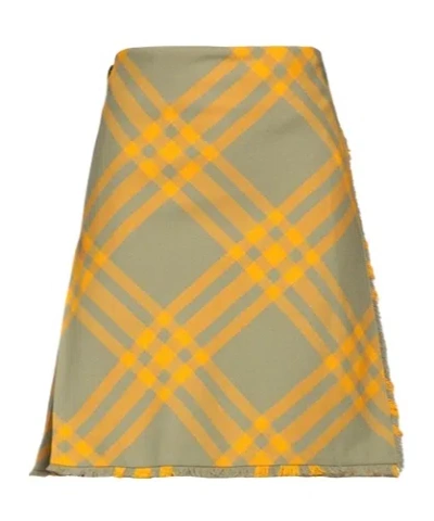 BURBERRY MINI SKITHE PLAID PATTERN WRAPS AROUND THE SKIRTRTS