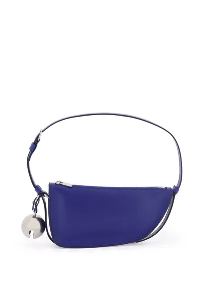 Burberry Navy Nappa Leather Mini Shoulder Bag With Shield Shape And Removable Charm In Blue