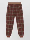 Burberry Trousers Featuring Elastic Waistband And Check Pattern In Brown
