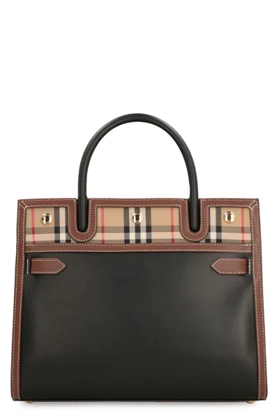 Burberry Vintage-inspired Leather Handbag With Decorative Stitching And Gold-tone Hardware In Black
