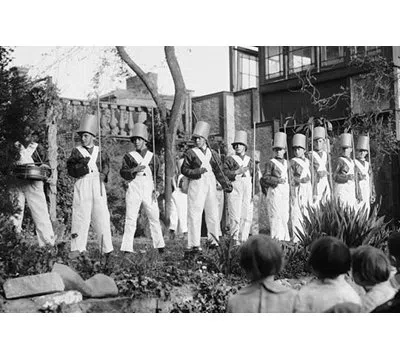 Buyenlarge Line Of Boys Pose As Soldiers With Inverted Pails On Their Heads - Photograph Print In Black;white