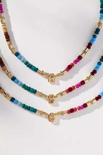By Anthropologie Beaded Monogram Necklace In Brown