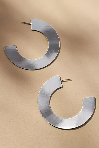 By Anthropologie Brushed Flat Hoop Earrings In Metallic