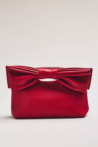 By Anthropologie Cutout Handle Bow Clutch In Red