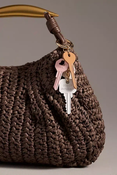 By Anthropologie Dangling Keys Bag Charm In Beige