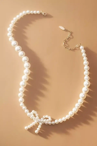 By Anthropologie Graduated Pearl Bow Necklace In White