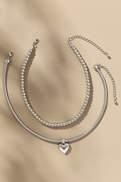 By Anthropologie Heart Charm Layered Necklaces, Set Of 2 In Silver
