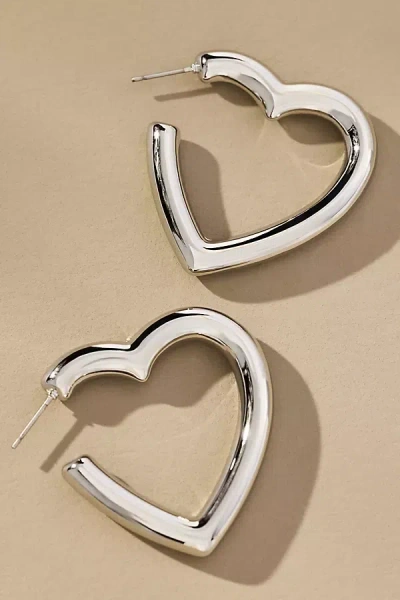 By Anthropologie Heart-shaped Hoop Earrings In Silver