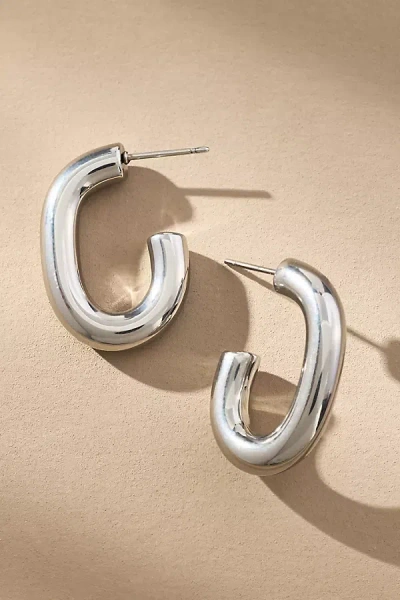 By Anthropologie Oval Huggie Hoop Earrings In Metallic