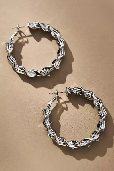 By Anthropologie Twisted Molten Hoop Earrings