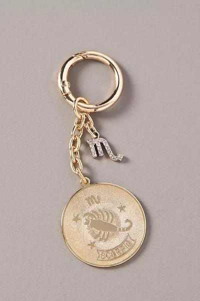 By Anthropologie Zodiac Pressed Coin Bag Charm In Gold