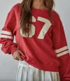 By Together Varsity Pullover In Red In Brown