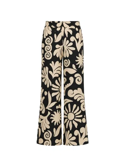 Cala De La Cruz Toya Floral-print Trousers In Black