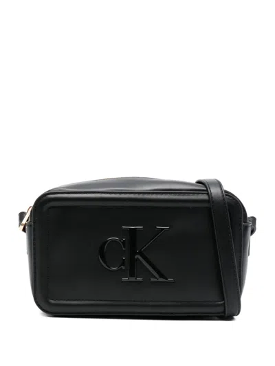 Calvin Klein Embossed-logo Cross Body Bag In Black