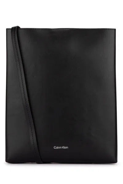 Calvin Klein Handbags. In Black
