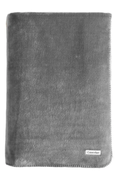 Calvin Klein Home Modern Reversible Solid Plush Blanket In Medium Grey