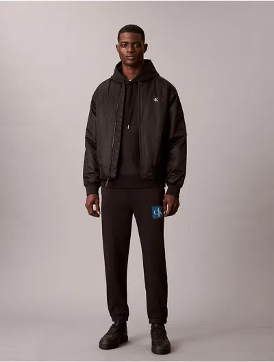 Calvin Klein Jeans Est.1978 Calvin Klein Men's Fleece Layered Monogram Graphic Sweatpants In Brown